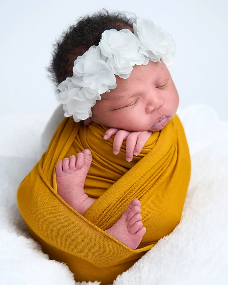Newborn photographer London - at-home session in family nursery