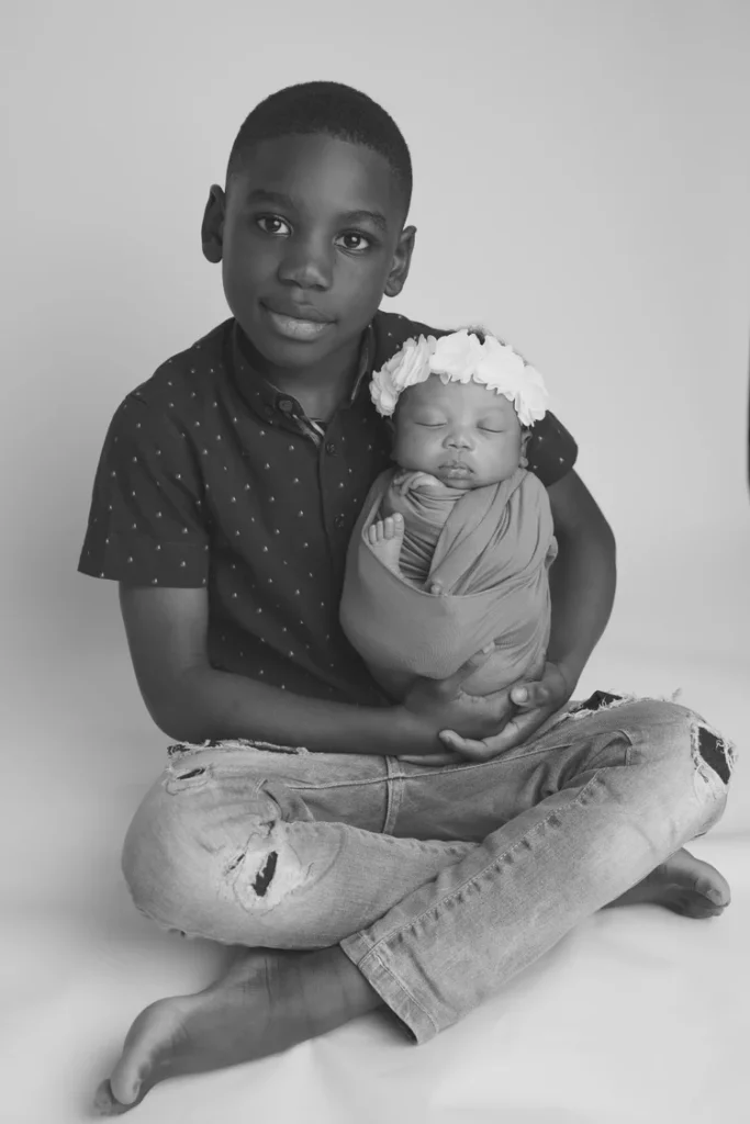 Newborn photography London - baby in classic wrapped pose during studio session
